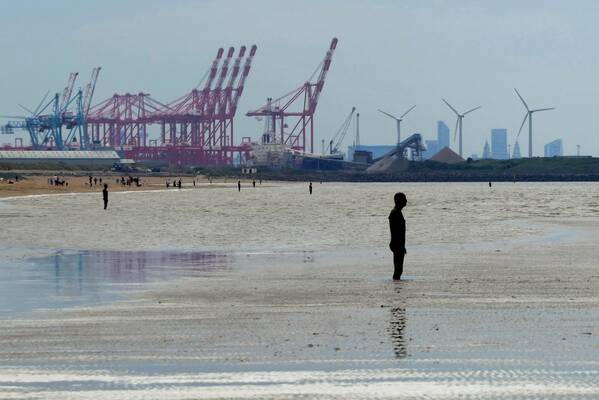 photographer Bitten by the Bug travel  photo. another place by antony gormley consists of one hundred lifesize naked steel statues modelled on himself placed at intervals across the beach facing out to sea.