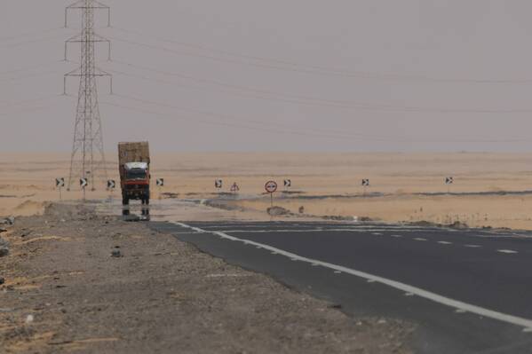 photographer Bitten by the Bug travel  photo. the drive from aswan to abu simbel takes several hours across a largely featureless desert  there is just this one truckstop along the way where travellers can get out and stretch their legs.