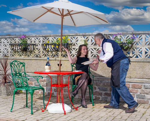 photographer StudioDee performance modelling photo. one of a series commissioned by an italian restaurant to line a staircase to the upper level  the premise being the waiter spills food on the guest who then strips to her lingerie while her dress is cleaned  
