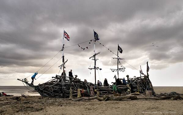 photographer Peter Davies architecture  photo. an old galleon made from timber and materials found washed up on the beach by the tide.